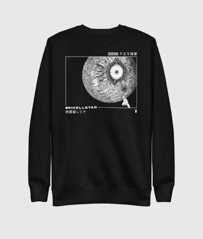 The HellStar Discover Sweater showcases a striking graphic of a detailed eyeball-like planet accompanied by retro-style text and Japanese characters, offering a unique display of sweater artistry.