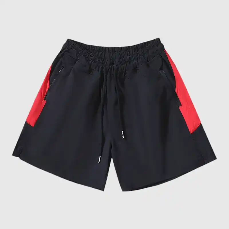 The "b" product features black athletic shorts with vibrant red side panels, an elastic waistband, and a drawstring. Designed for both sports and leisure activities, these shorts provide comfort as well as style. The "b" product features black athletic shorts with vibrant red side panels, an elastic waistband, and a drawstring. Designed for both sports and leisure activities, these shorts provide comfort as well as style.