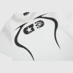 The Hellstar Warm Up T-Shirt features a bold black design with a stylized pill, enhanced by a star and flame, surrounded by dynamic curved lines—an ideal addition to elevate your casual wardrobe.